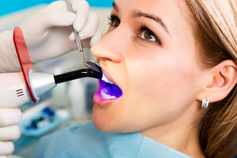 Dentist Performing Dental Bonding Procedure In Fonthill & Welland, ON